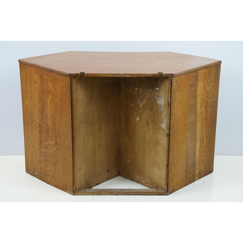 671 - 20th century oak kneehole desk, with a hexagonal top over an arrangement of six drawers, 62cm high x... 