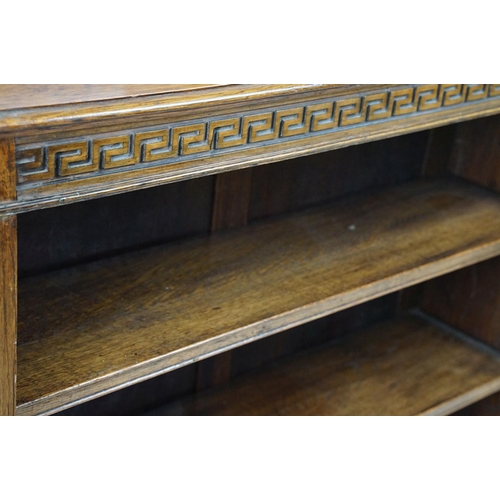 684 - Oak three shelf bookcase with Greek key frieze design, 102cm high x 92cm wide x 26cm deep