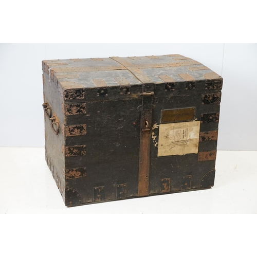 697 - Early 20th century oak and metal mounted travelling trunk, with two handles to each side, brass plaq... 