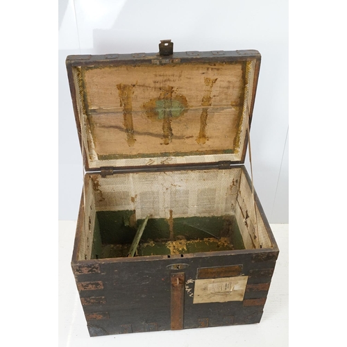 697 - Early 20th century oak and metal mounted travelling trunk, with two handles to each side, brass plaq... 