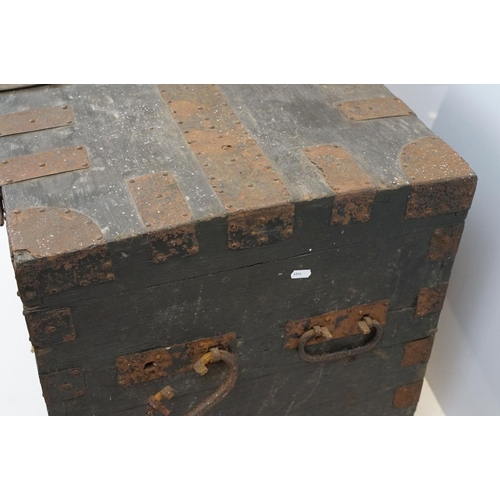 697 - Early 20th century oak and metal mounted travelling trunk, with two handles to each side, brass plaq... 