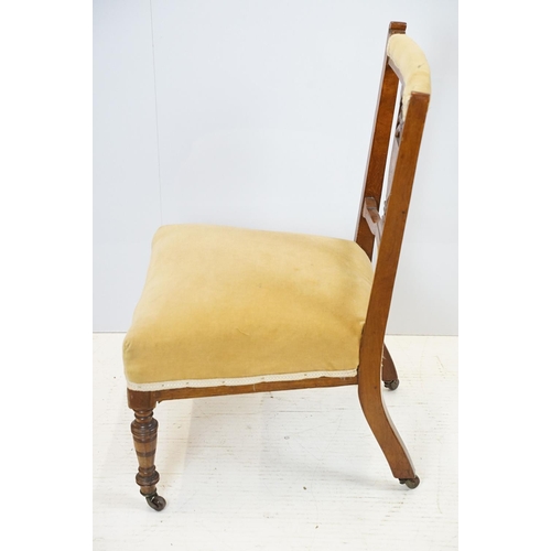 702 - Edwardian mahogany low chair, with pierced inlaid splat back, on turned tapering legs and castors, 7... 