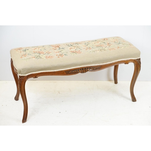 703 - 20th century mahogany carved long stool, with foliage and berry decorated needlework top, 47cm high ... 