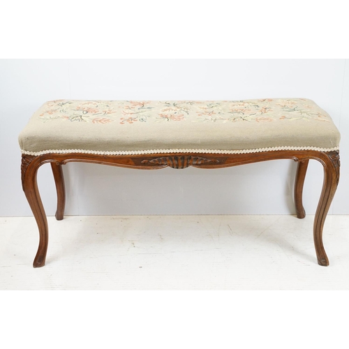 703 - 20th century mahogany carved long stool, with foliage and berry decorated needlework top, 47cm high ... 