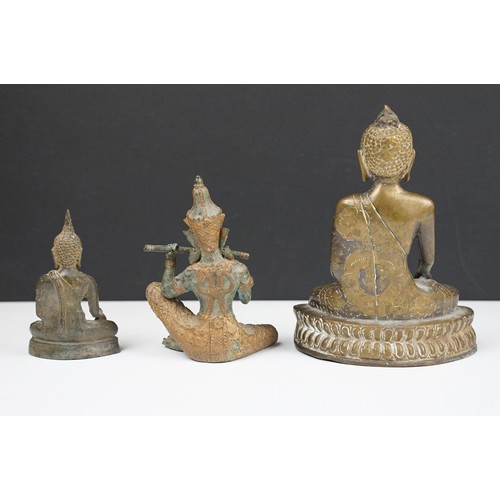 104A - Two bronze seated Buddhas and a statue of a seated Thai prince playing a flute (possibly Prince Phra... 