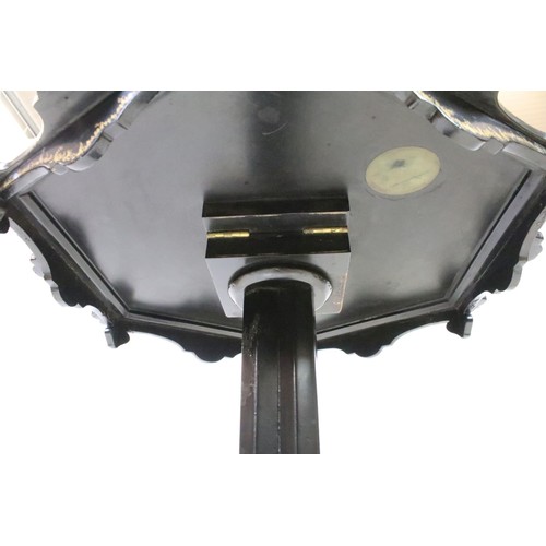 656 - Victorian Papier Mache Tilt Top Table, the shaped top with mother of pearl and gilt decoration havin... 