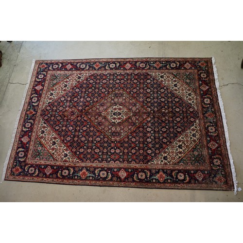 706 - Vintage blue ground Persian Tabriz carpet with traditional medallion design and multi-coloured field... 