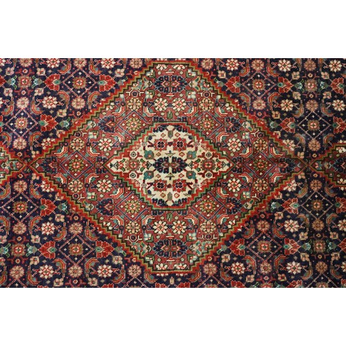 706 - Vintage blue ground Persian Tabriz carpet with traditional medallion design and multi-coloured field... 