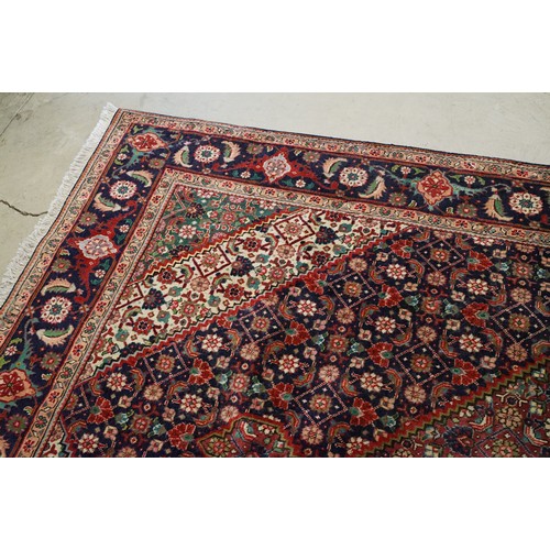 706 - Vintage blue ground Persian Tabriz carpet with traditional medallion design and multi-coloured field... 