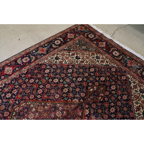 706 - Vintage blue ground Persian Tabriz carpet with traditional medallion design and multi-coloured field... 