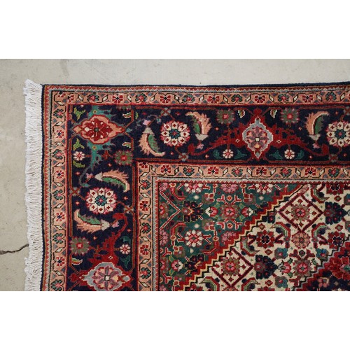 706 - Vintage blue ground Persian Tabriz carpet with traditional medallion design and multi-coloured field... 