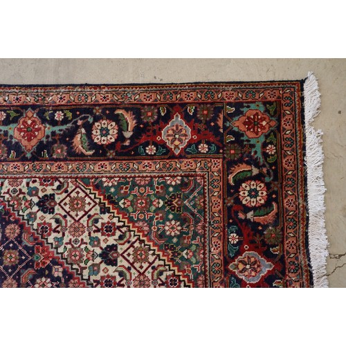 706 - Vintage blue ground Persian Tabriz carpet with traditional medallion design and multi-coloured field... 