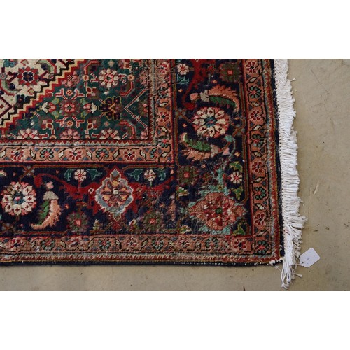 706 - Vintage blue ground Persian Tabriz carpet with traditional medallion design and multi-coloured field... 