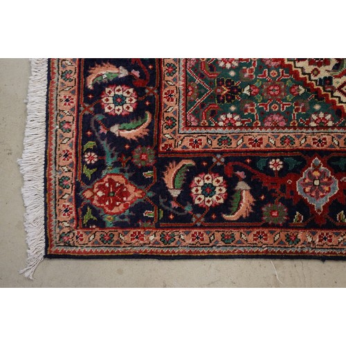 706 - Vintage blue ground Persian Tabriz carpet with traditional medallion design and multi-coloured field... 