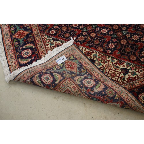 706 - Vintage blue ground Persian Tabriz carpet with traditional medallion design and multi-coloured field... 