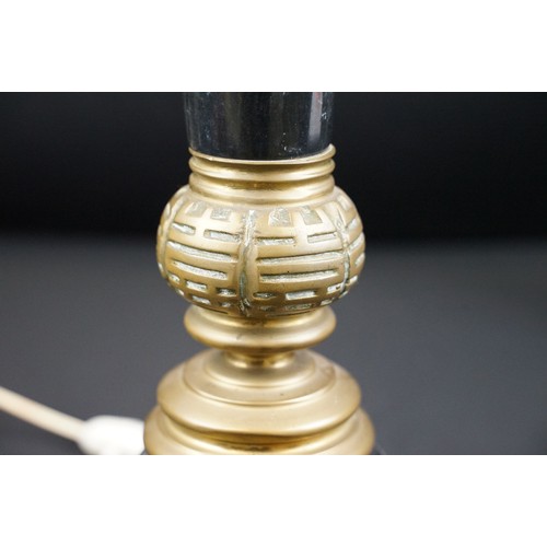 169A - Two black marble table lamps with brass mounts, the tallest 65cm high