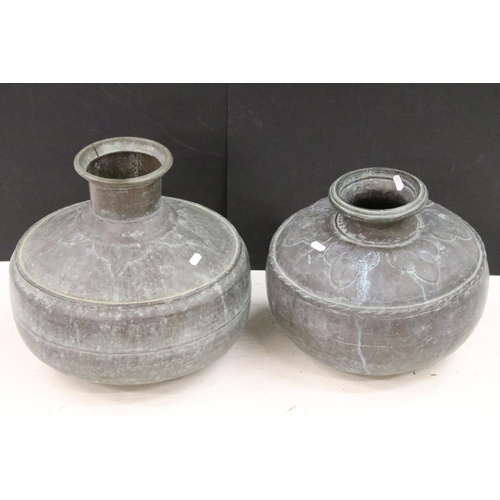 185 - Two Indian copper hammered water vessels each of round form with open tops, with hammered detailing ... 