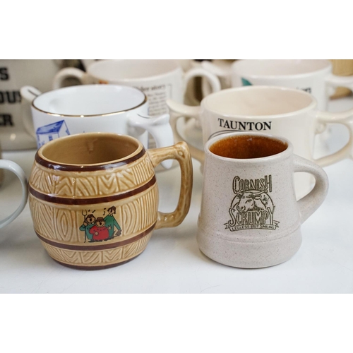 125 - Collection of cider bottles and mugs to include the Taunton cider company, Matthew Clarke, Coombes c... 