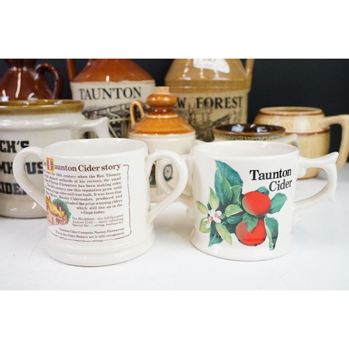 125 - Collection of cider bottles and mugs to include the Taunton cider company, Matthew Clarke, Coombes c... 