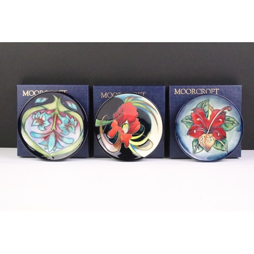 15 - Three Moorcroft small shallow dishes, comprising: Satin Flower pattern, 12cm diameter, boxed, Cleopa... 