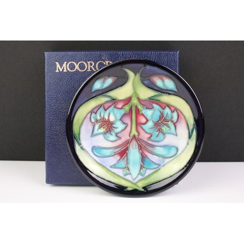 15 - Three Moorcroft small shallow dishes, comprising: Satin Flower pattern, 12cm diameter, boxed, Cleopa... 