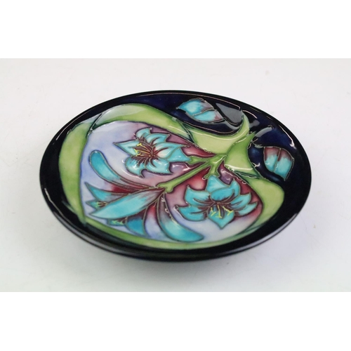 15 - Three Moorcroft small shallow dishes, comprising: Satin Flower pattern, 12cm diameter, boxed, Cleopa... 