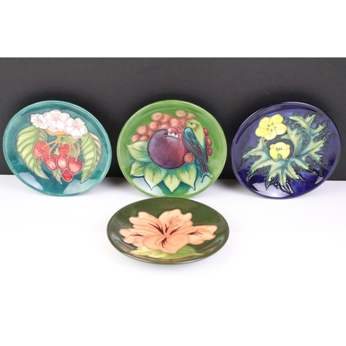 18 - Four Moorcroft small shallow dishes, comprising: Hibiscus pattern, Finch and Fruit pattern, Buttercu... 