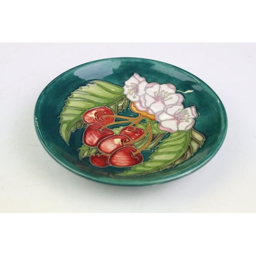 18 - Four Moorcroft small shallow dishes, comprising: Hibiscus pattern, Finch and Fruit pattern, Buttercu... 