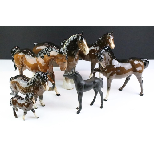 27 - Collection of seven Beswick porcelain horses / ponies to include six brown gloss examples and a matt... 