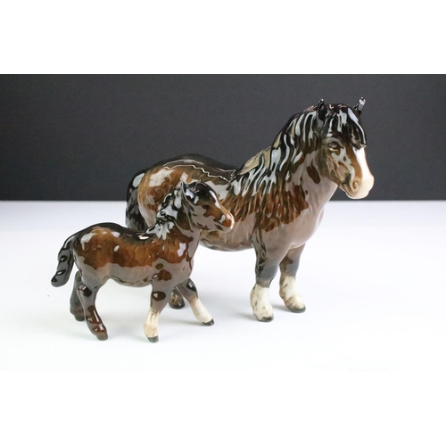 27 - Collection of seven Beswick porcelain horses / ponies to include six brown gloss examples and a matt... 