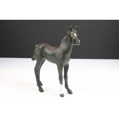 27 - Collection of seven Beswick porcelain horses / ponies to include six brown gloss examples and a matt... 