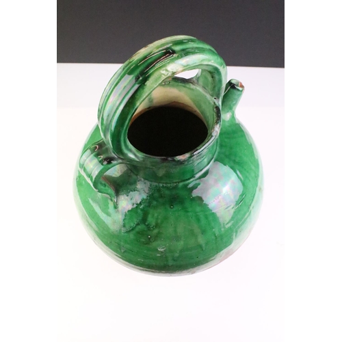 31 - Large pottery green glazed wine ewer, approx 38cm tall