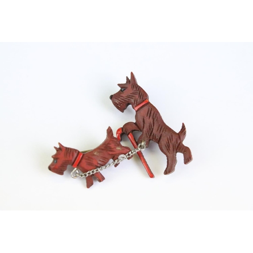 33 - Art Deco pin brooch in the form of two terriers, one walking with a cane, with red collar detail