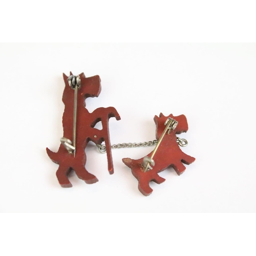 33 - Art Deco pin brooch in the form of two terriers, one walking with a cane, with red collar detail