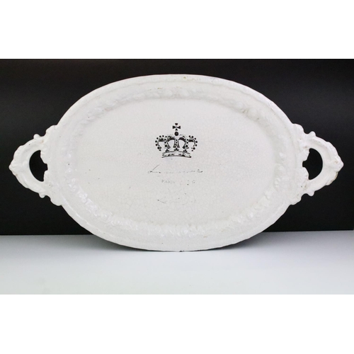 52 - French white glazed ceramic serving platter of oval form, with crown to centre, inscribed 'Paris', p... 