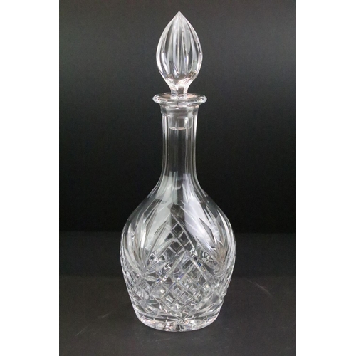 65 - Collection of cut glass to include four decanters with stoppers, a large footed bowl and a cut glass... 