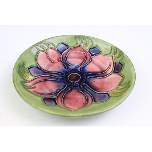 72 - Two Moorcroft pottery pin dishes to include a Cluny pattern dish and an Anemone pattern pin dish on ... 