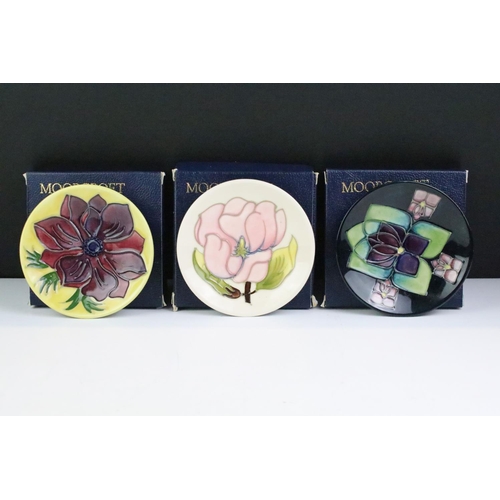 75 - Three boxed Moorcroft pottery pin dishes to include Violet, Anemone on yellow ground & Magnolia on i... 