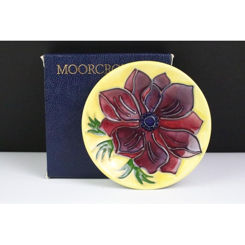 75 - Three boxed Moorcroft pottery pin dishes to include Violet, Anemone on yellow ground & Magnolia on i... 