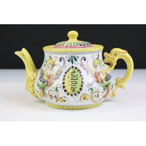 58 - Italian faience tea set with scrolling & floral decoration and yellow border, the lot to include tea... 