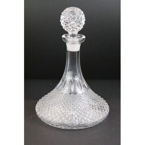 65 - Collection of cut glass to include four decanters with stoppers, a large footed bowl and a cut glass... 