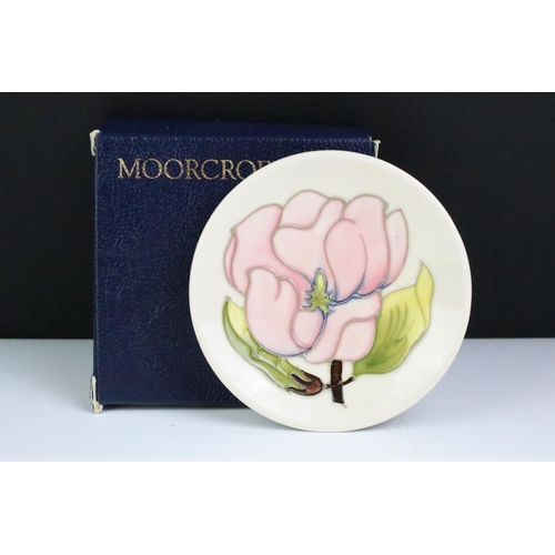 75 - Three boxed Moorcroft pottery pin dishes to include Violet, Anemone on yellow ground & Magnolia on i... 