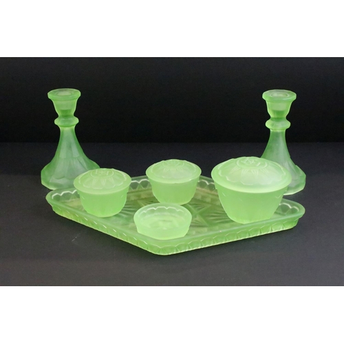 94 - Early-to-mid 20th century frosted uranium glass dressing table set, comprising candlesticks, jars, d... 