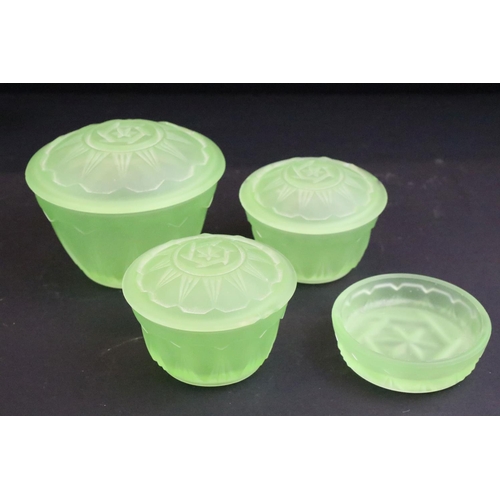 94 - Early-to-mid 20th century frosted uranium glass dressing table set, comprising candlesticks, jars, d... 