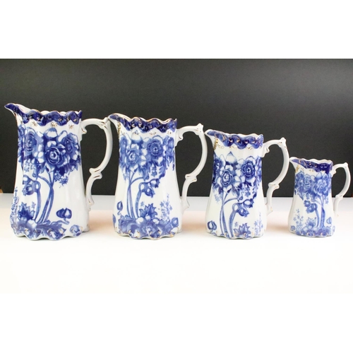 101 - Set of five Ironstone blue & white graduating jugs with gilt details, plus a 19th century W.H. Grind... 