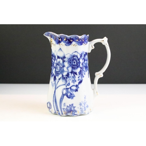 101 - Set of five Ironstone blue & white graduating jugs with gilt details, plus a 19th century W.H. Grind... 