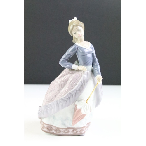 102 - Lladro porcelain Evita Girl With Parasol (5212), together with a Kaiser white porcelain vase of flat... 