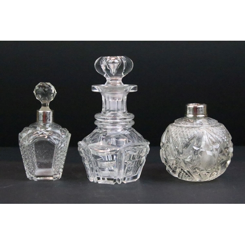 110 - Collection of 12 cut glass perfume bottles & jars to include silver collared & silver lidded example... 