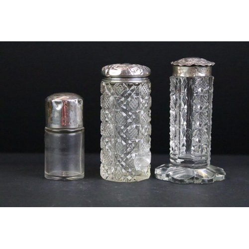 110 - Collection of 12 cut glass perfume bottles & jars to include silver collared & silver lidded example... 