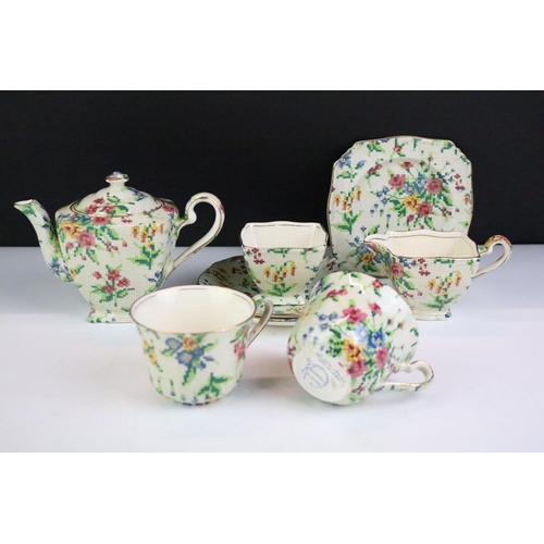 128 - Royal Winton Grimwades Queen Anne pattern tea set for two, transfer printed with chintz floral needl... 